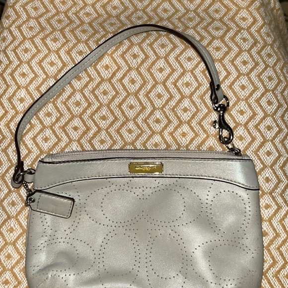 Coach Handbags - Tan coach wristlet. Very good condition.